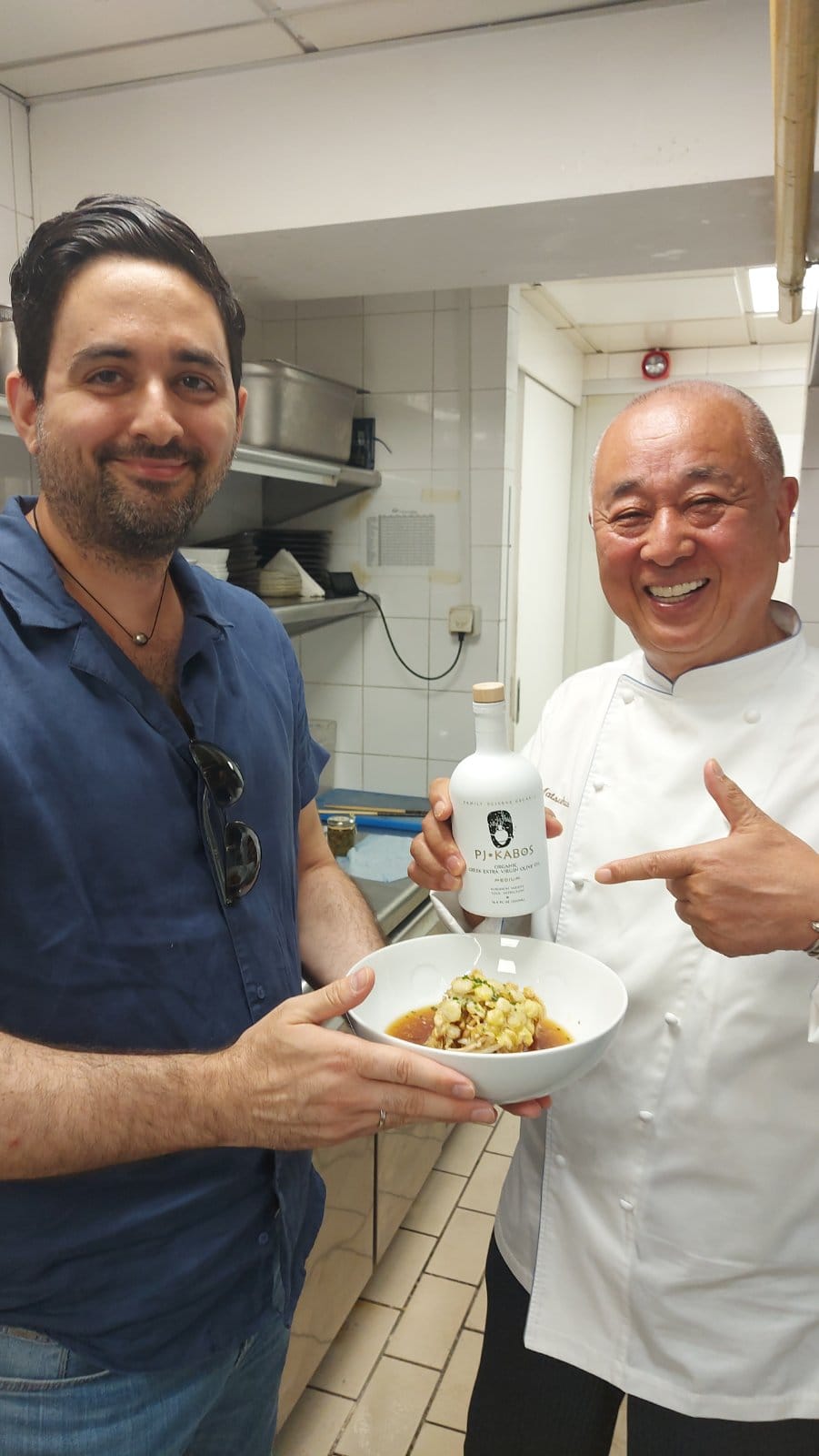 Chef Nobu Matsuhisa, pointing to a bottle of PJ KABOS extra virgin olive oil. He uses it in his Nobu and Matsuhisa restaurants and hotels around the world. 