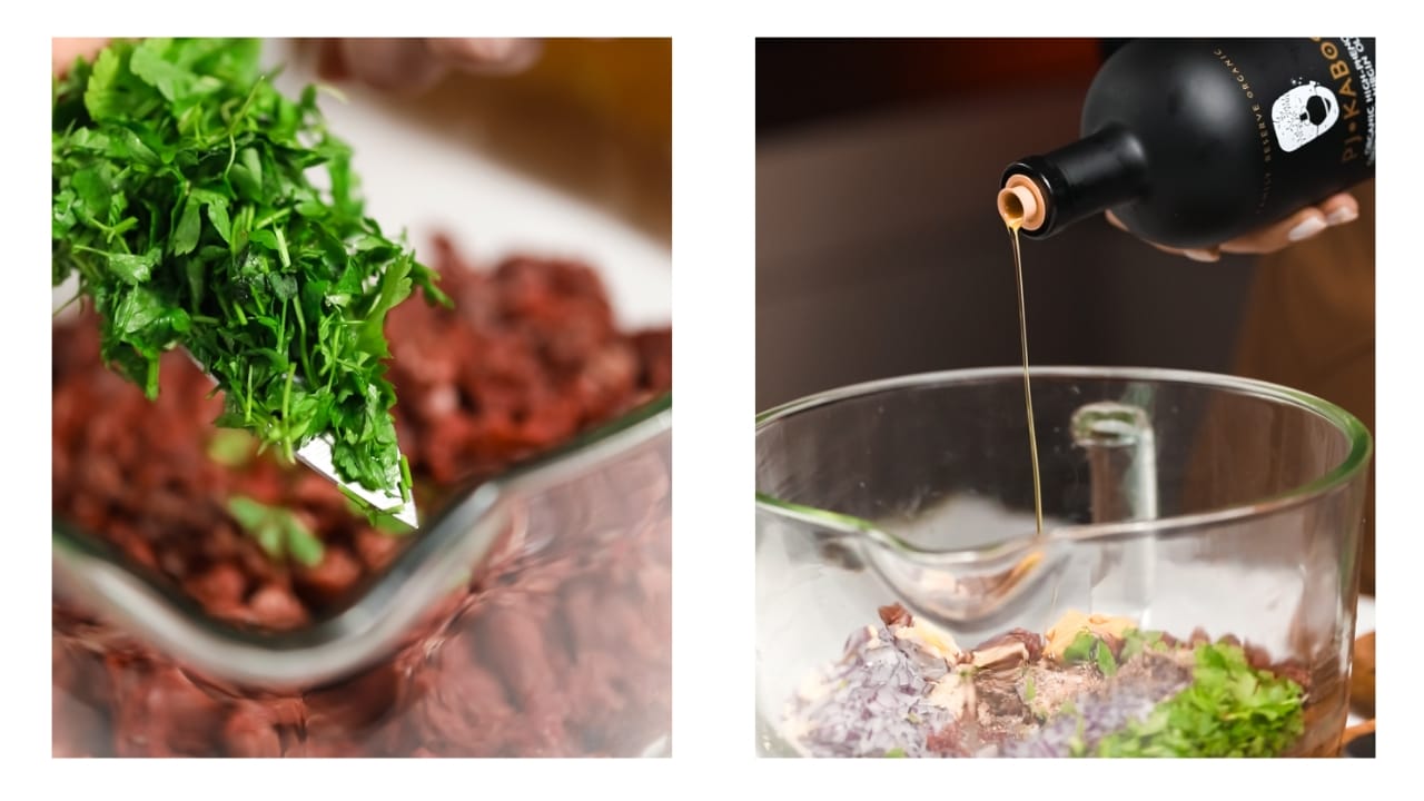 Parsley and olive oil being added to raw hamburger meat.