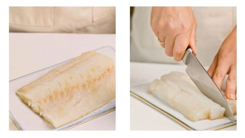 A cook cutting up a filet of fish - Atlantic Cod.