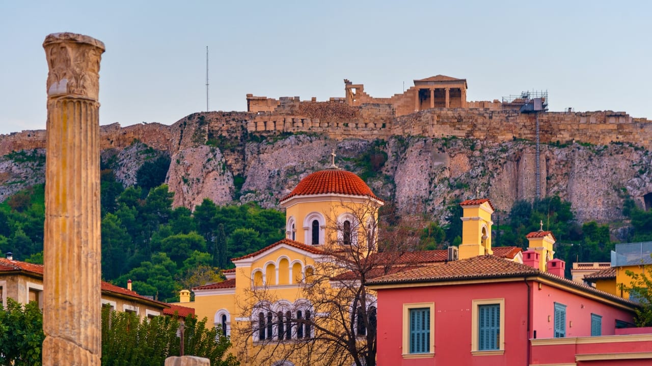 The Old town of Athens with the Acropolis above it. The Erechtheion's front columns can be seen and in the background, the Parthenon.