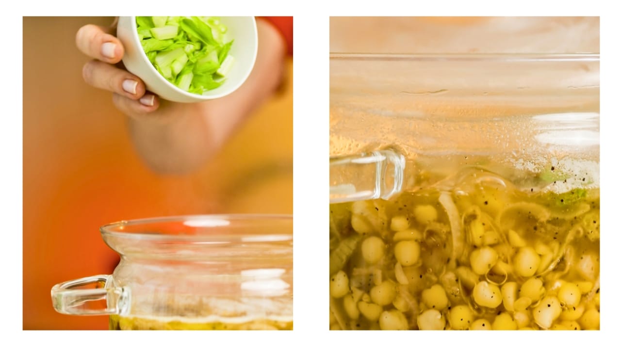 Fresh celery and pepper are being added to boiling split peas.