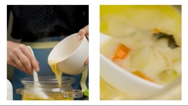 Avgolemono sauce being gently blended with the soup in a pot.