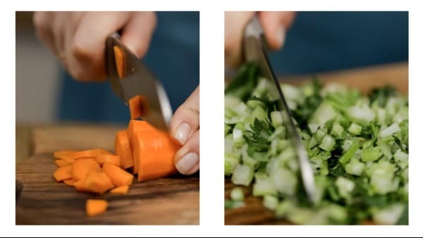 Carrots and celery being chopped.