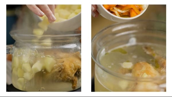 A pot of chicken soup being brought to a boil.