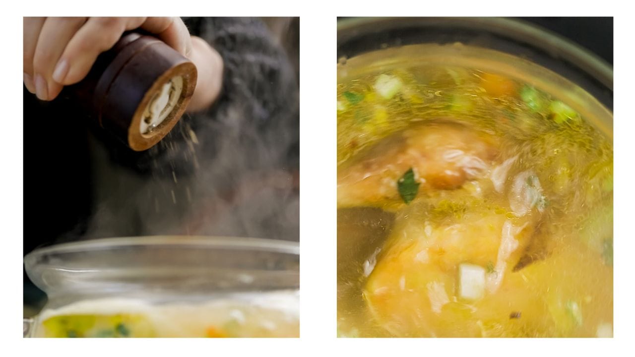 Chicken soup being seasoned with salt and pepper.